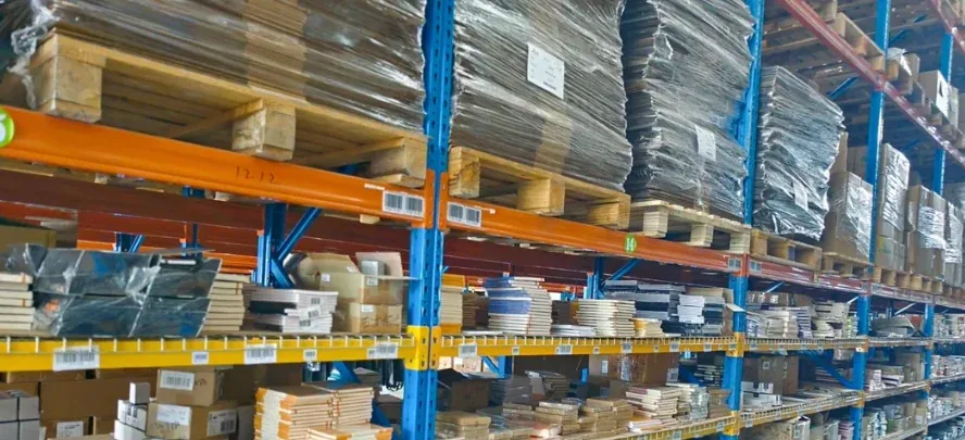 Warehouse racks with cartons and stored goods